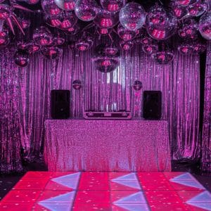 70s silver disco theme led dance floor, dj booth, and silver mirror balls