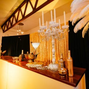 1920s themed bar setup with themed props and decor