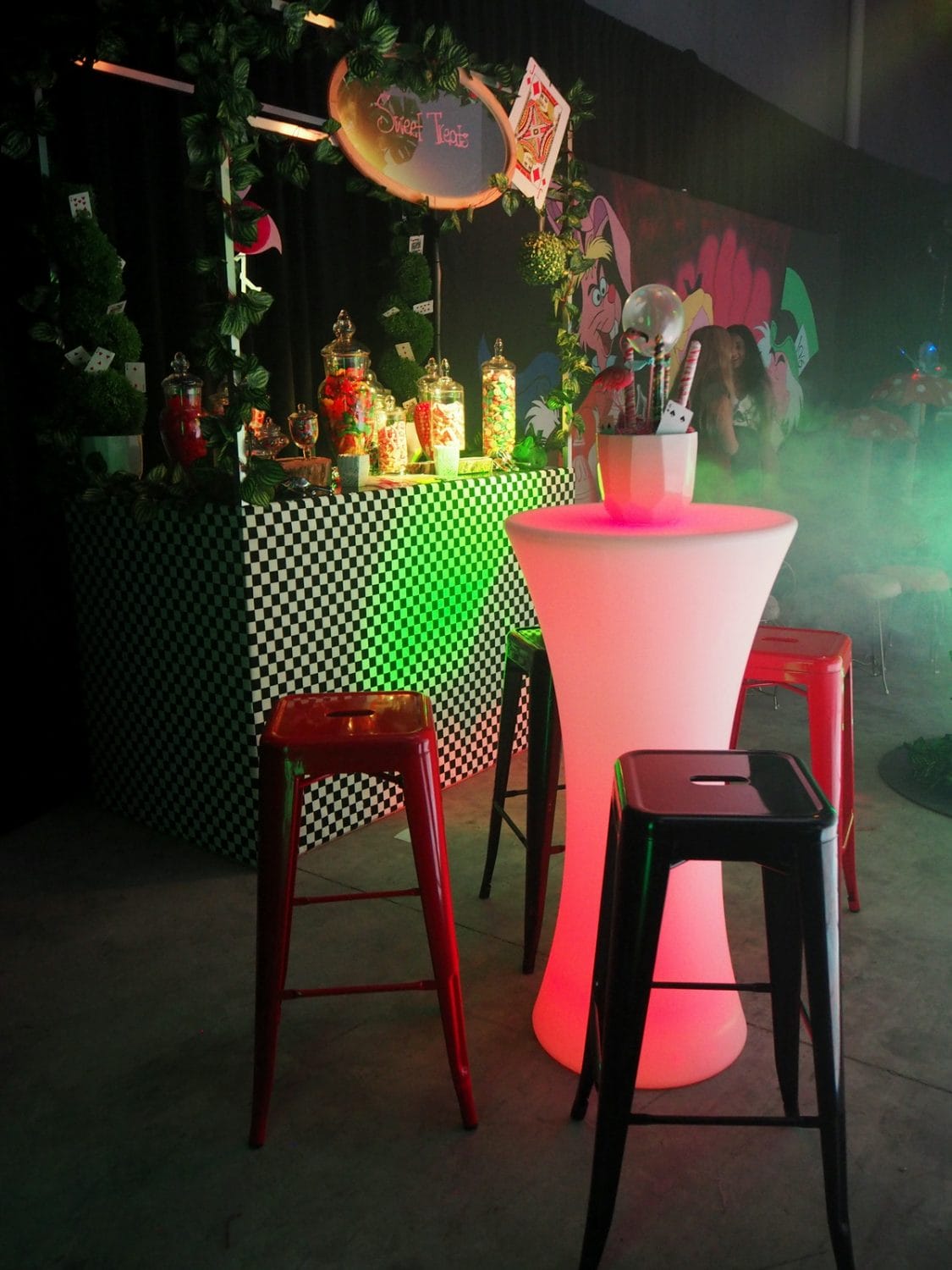 alice in wonderland themed event bar tables and stools