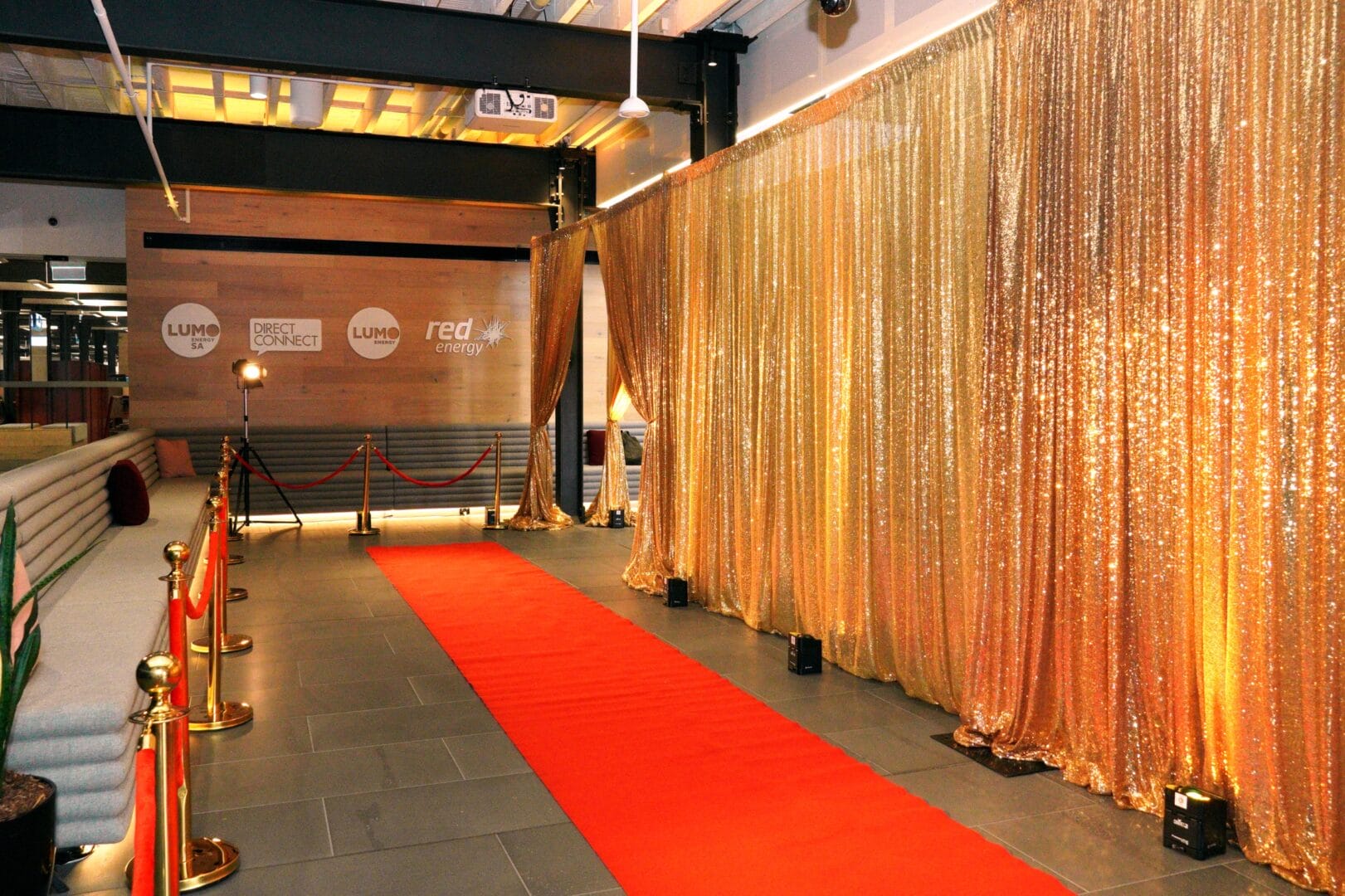 red carpet and gold sequin drape