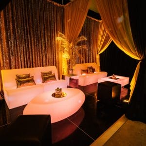 illuminated lounge furniture and gold draping studio 54 theme