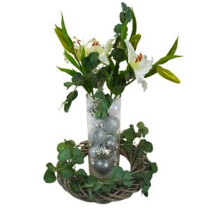 christmas centrepiece with white flowers and silver ornaments