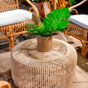 greenery floral centrepiece on a rattan coffee table at safari themed setup