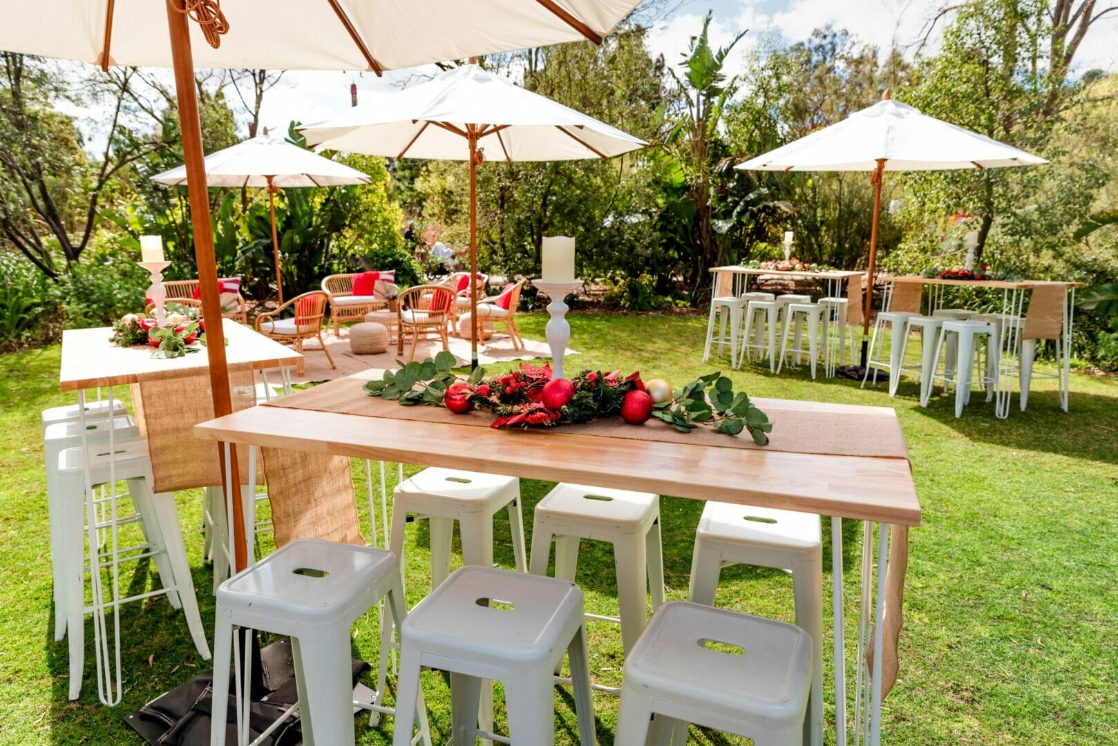 Bar tables and stools setup for christmas themed garden party