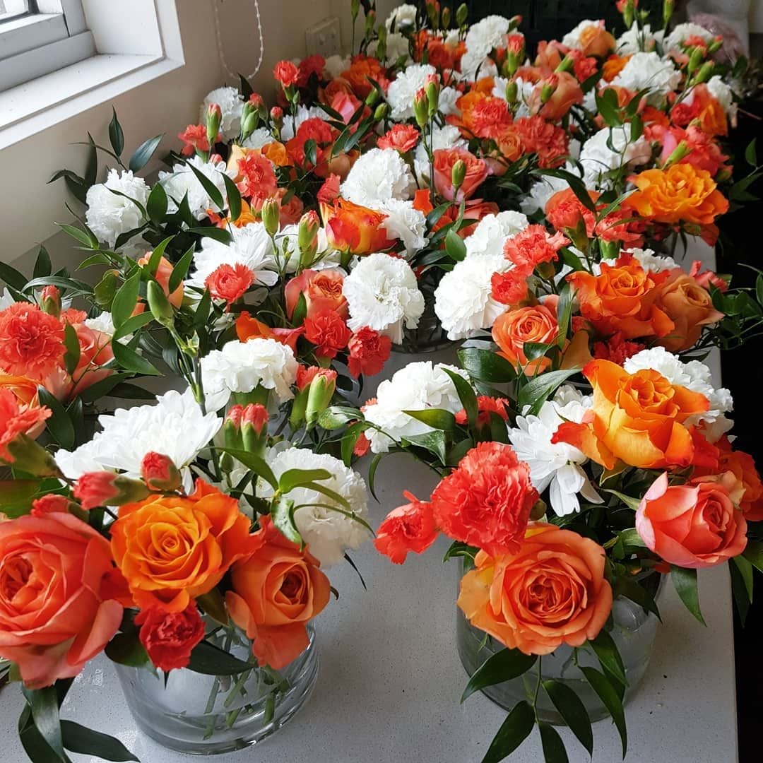 melbourne event florists - blossoming tales - orange and white floral arrangements