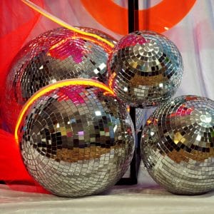 silver mirror balls, neon strip lighting, fluro tulle