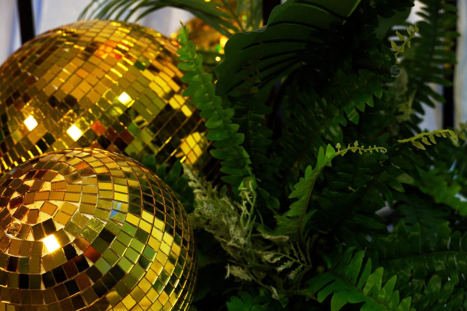 gold mirror balls and greenery