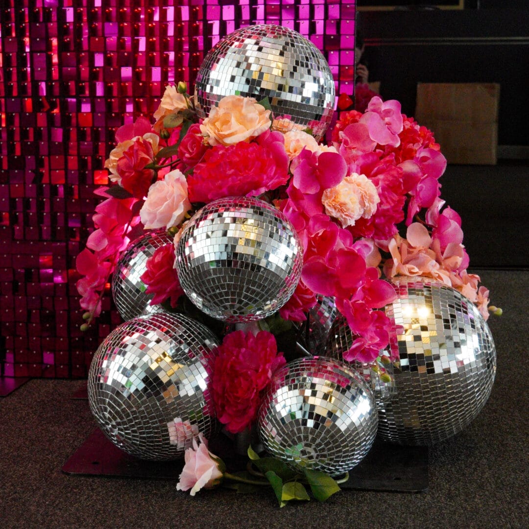 pink florals and silver disco ball installation
