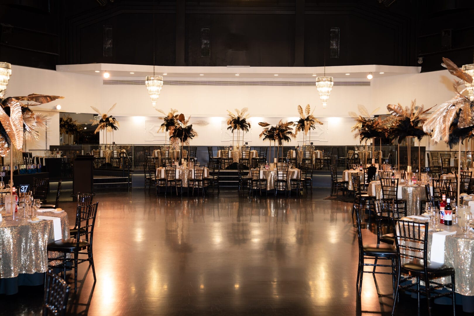 black and gold floral centrepieces at 1920s themed end of year gala