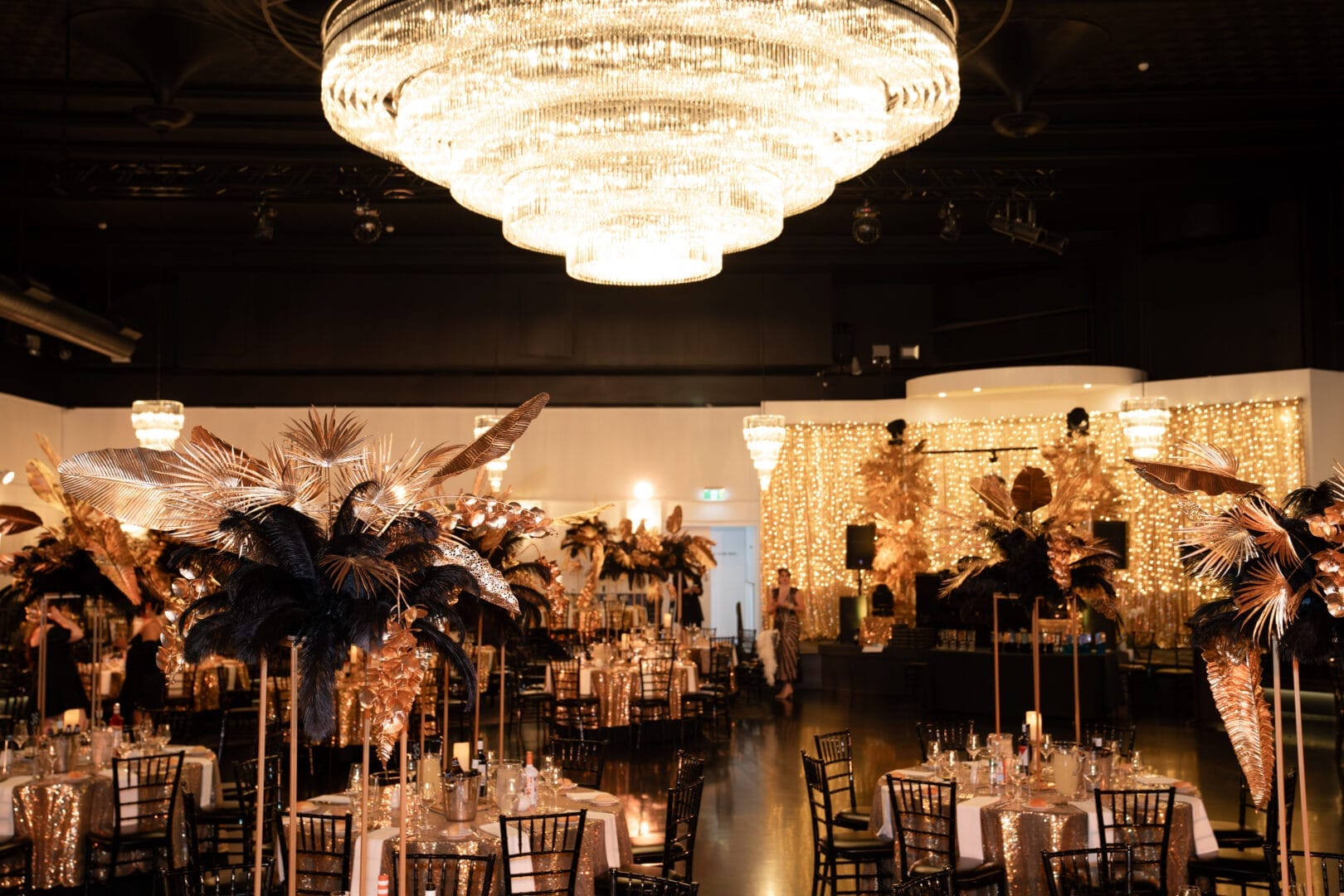 tables with black and gold gatsby inspired centrepieces