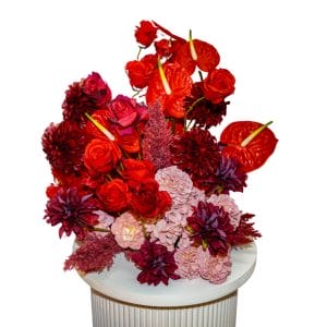 red and dusty pink floral centrepiece
